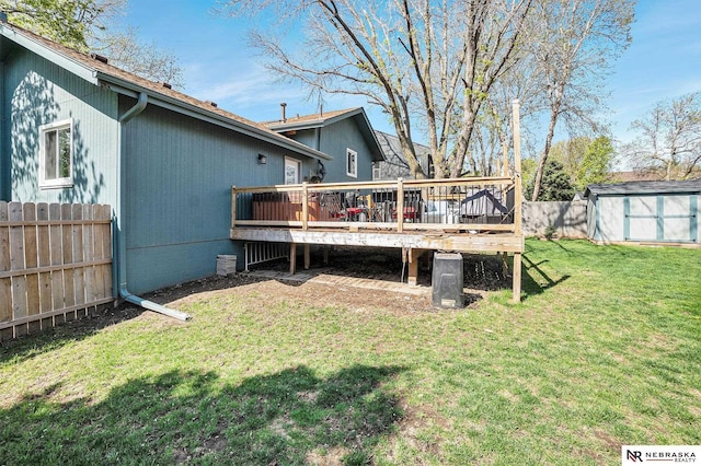 exterior space featuring fence, a storage unit, an outdoor structure, and a deck