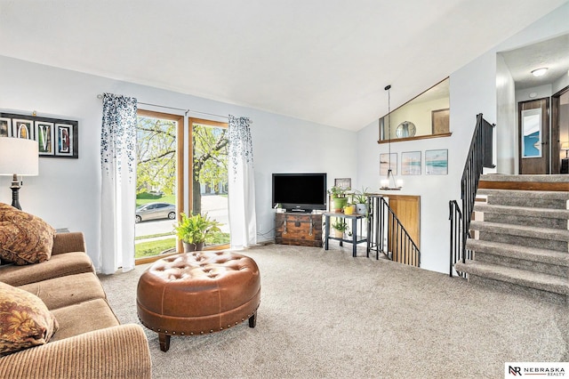 living room with carpet flooring and vaulted ceiling