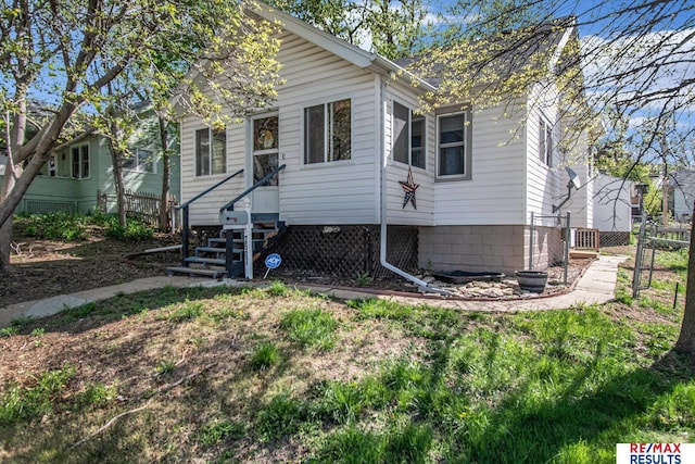 bungalow with fence and entry steps