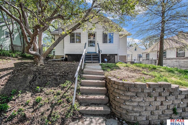 view of front of house featuring fence