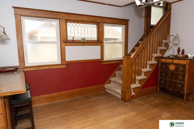 650 E 9th St, York, NE 68467 - staircase featuring wood finished floors and crown molding
