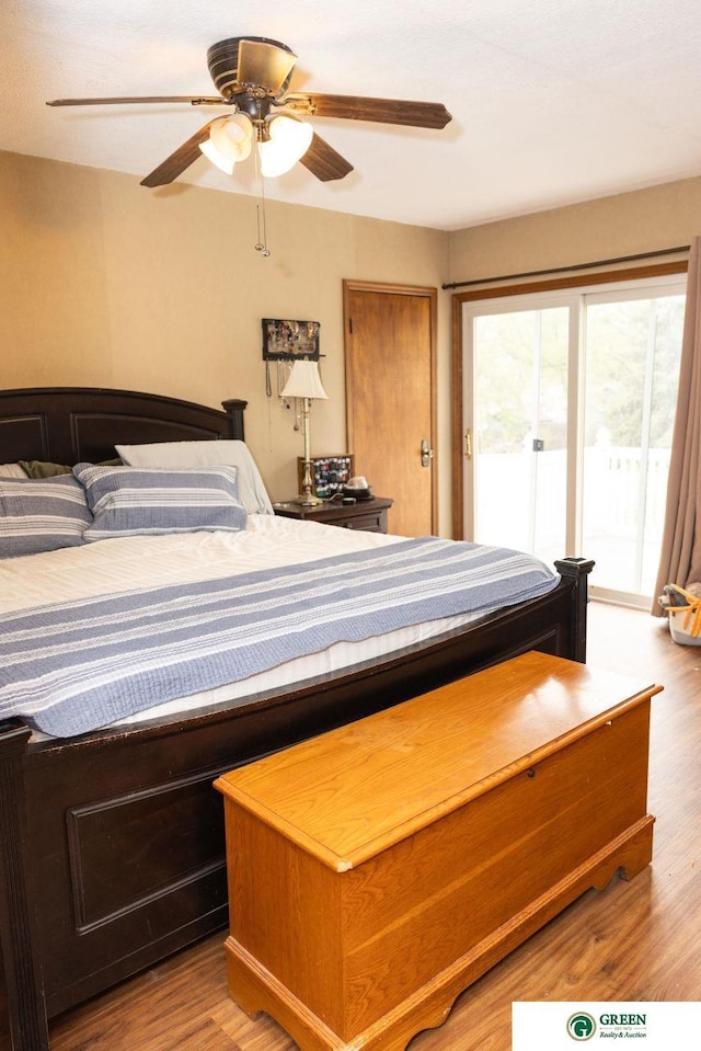 650 E 9th St, York, NE 68467 - bedroom with access to exterior, ceiling fan, and wood finished floors