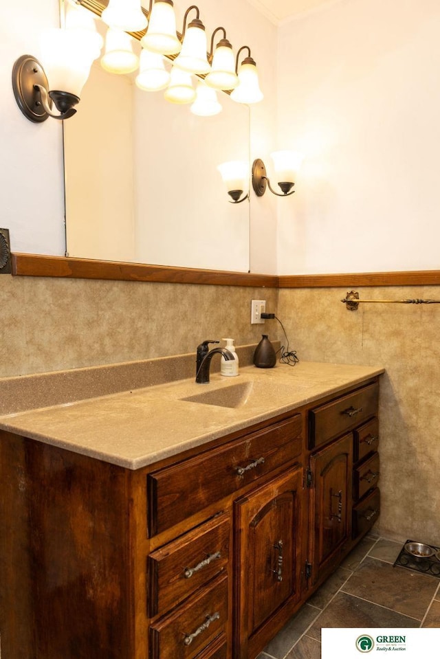 650 E 9th St, York, NE 68467 - bathroom featuring vanity, a wainscoted wall, and tile walls