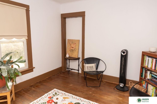 650 E 9th St, York, NE 68467 - living area featuring crown molding and wood finished floors