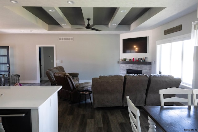 living room featuring a ceiling fan, recessed lighting, visible vents, a fireplace, and dark wood-style floors