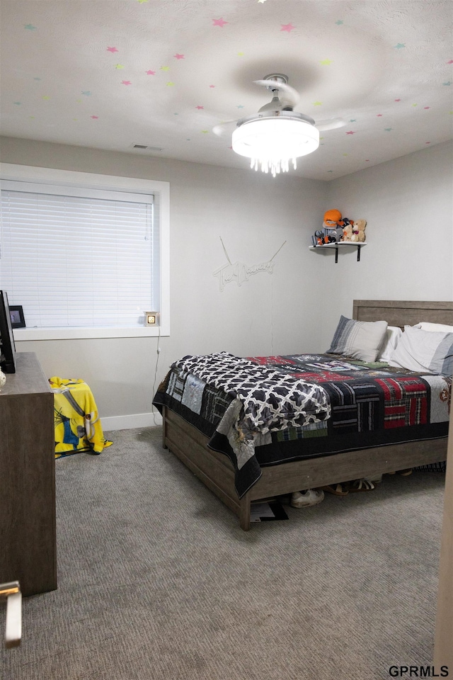 carpeted bedroom featuring baseboards
