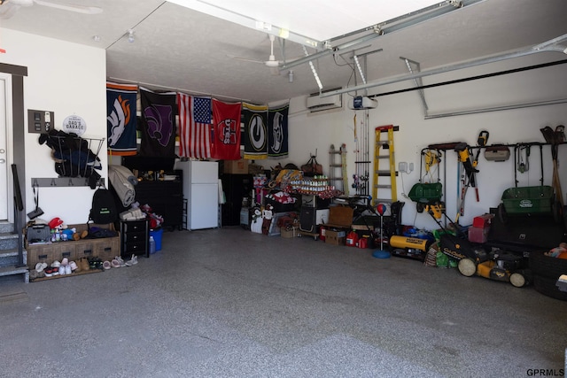garage with freestanding refrigerator and a garage door opener