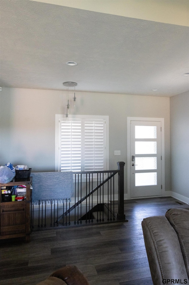 interior space with recessed lighting, baseboards, and wood finished floors