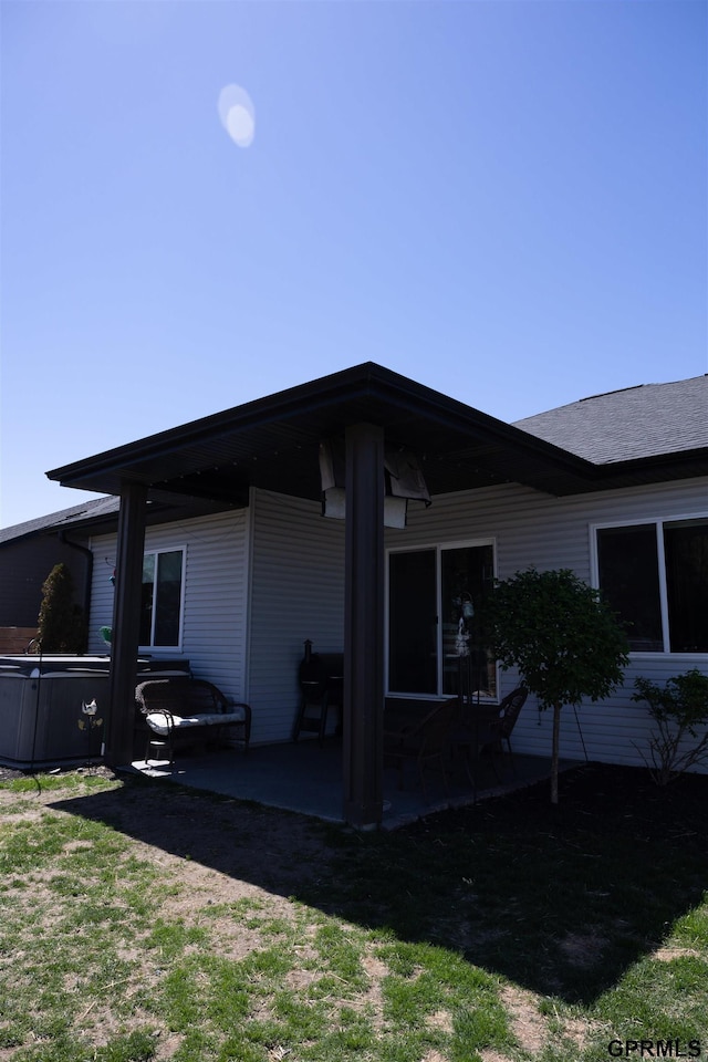 back of property featuring a patio area
