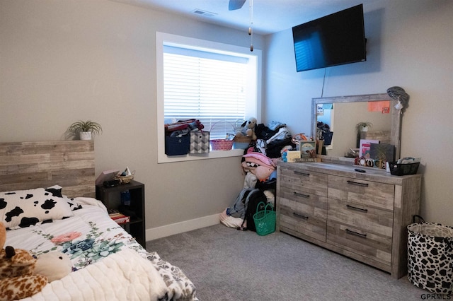 bedroom with visible vents, baseboards, ceiling fan, and carpet floors