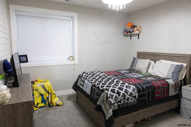 bedroom with carpet and baseboards
