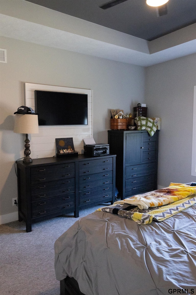 bedroom featuring light carpet and ceiling fan