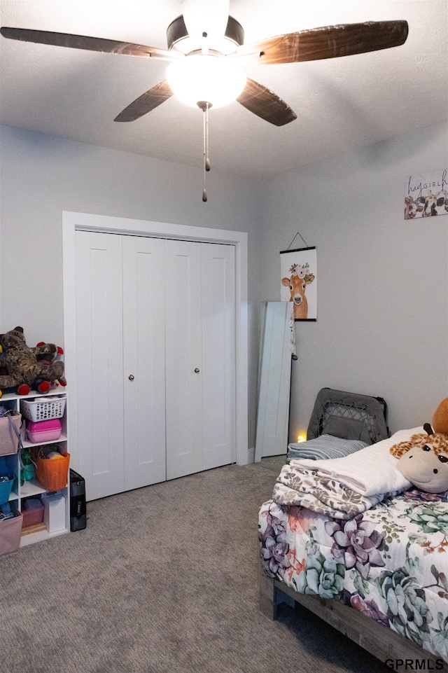 bedroom featuring carpet flooring, a closet, and ceiling fan