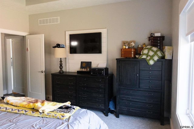 carpeted bedroom with visible vents