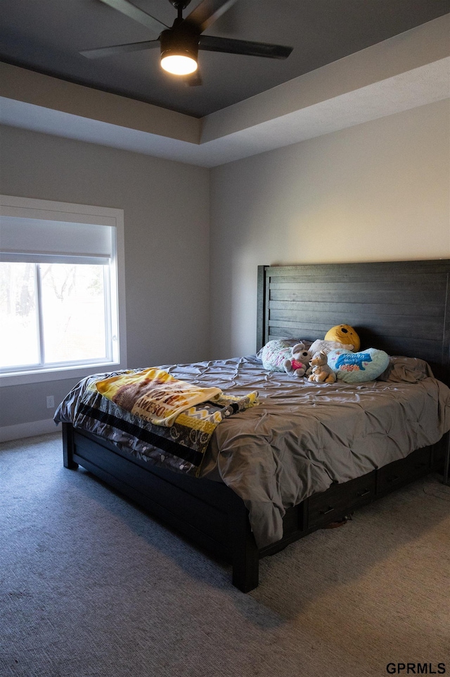 carpeted bedroom with a ceiling fan