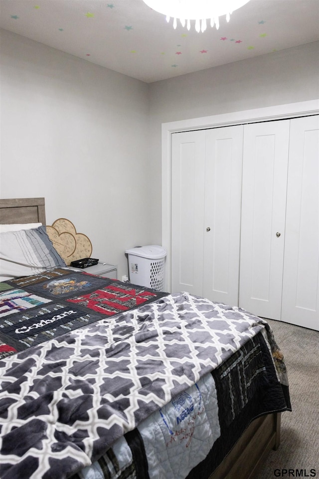 bedroom with carpet floors and a closet
