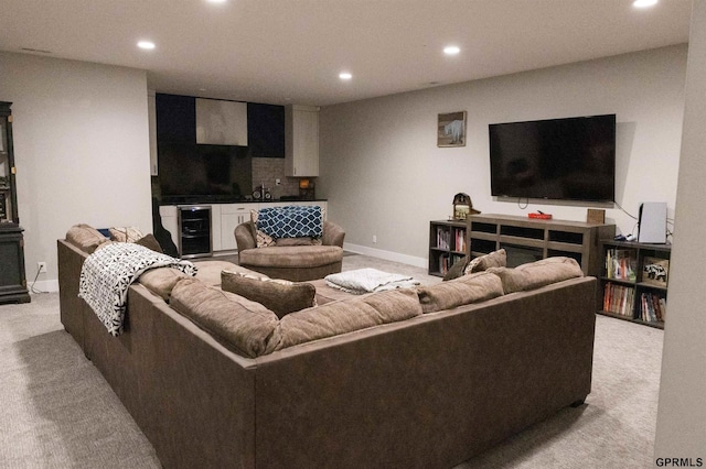 living area with beverage cooler, light carpet, baseboards, and recessed lighting