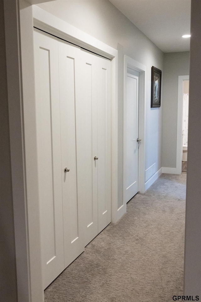 corridor featuring carpet flooring, baseboards, and recessed lighting