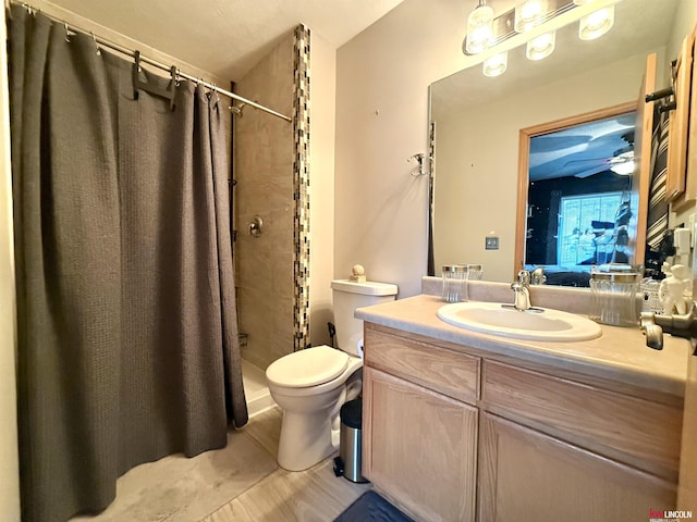ensuite bathroom with toilet, a shower stall, vanity, and ensuite bath