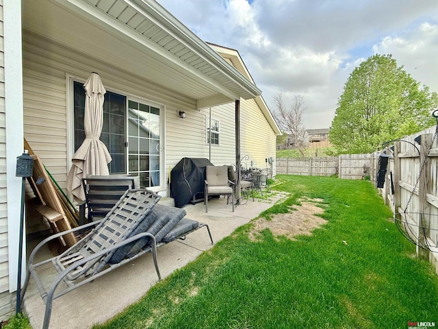 view of patio featuring area for grilling and a fenced backyard