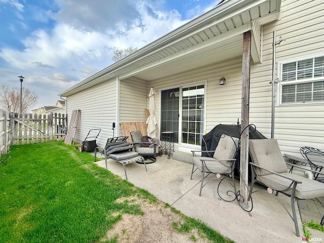 view of patio featuring fence