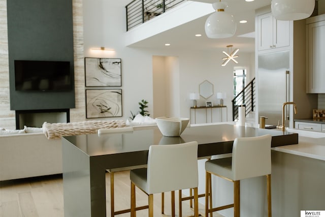 interior space with stairs, recessed lighting, and light wood-style flooring