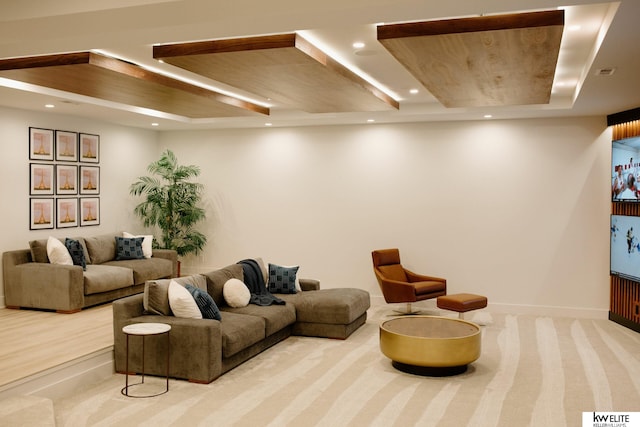 living room with baseboards, a tray ceiling, recessed lighting, and carpet flooring
