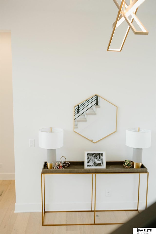 room details featuring baseboards and wood finished floors