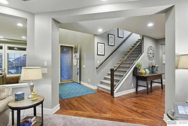 entrance foyer featuring baseboards, recessed lighting, wood finished floors, and stairway