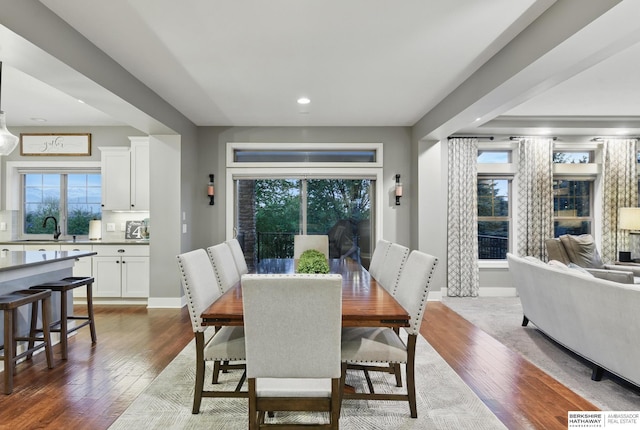 dining area with recessed lighting, dark wood finished floors, and a healthy amount of sunlight
