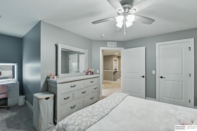 bedroom with carpet floors, a ceiling fan, baseboards, and visible vents