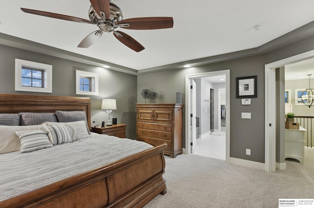 bedroom featuring baseboards, light carpet, and recessed lighting