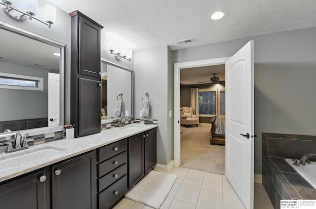 bathroom featuring a sink, ensuite bathroom, double vanity, and visible vents