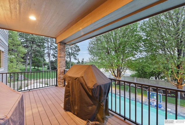 deck with a fenced in pool and a fenced backyard