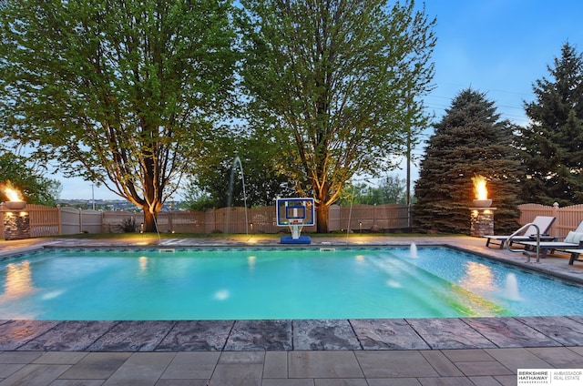 view of pool with a fenced in pool, a fenced backyard, and a patio