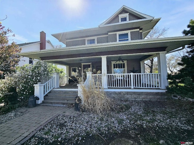 country-style home with covered porch and ceiling fan
