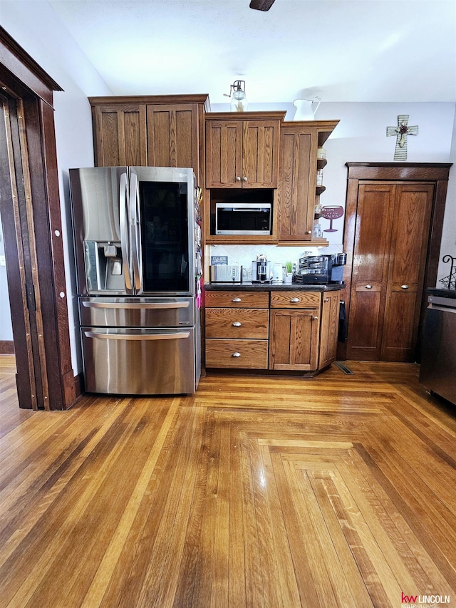 kitchen featuring dark countertops, open shelves, and appliances with stainless steel finishes