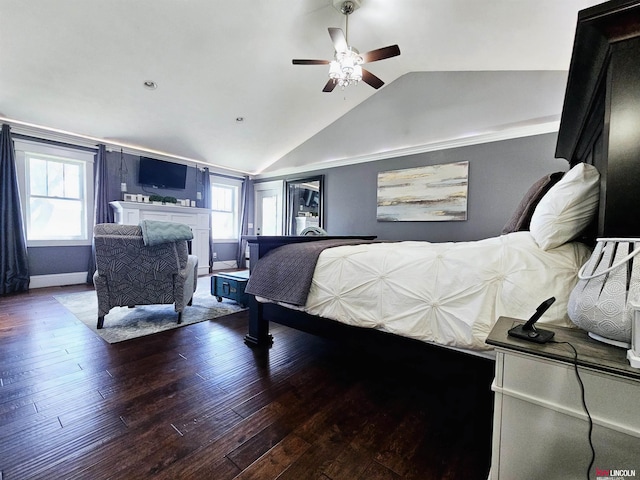 bedroom with wood-type flooring, vaulted ceiling, and multiple windows