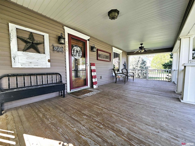 wooden deck with ceiling fan and a porch
