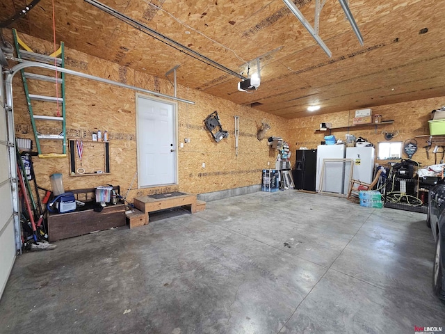 garage featuring a workshop area and a garage door opener