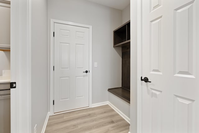 mudroom with light wood-type flooring and baseboards