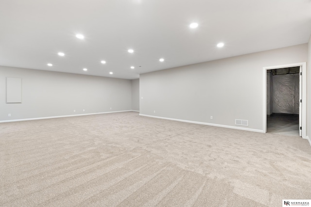 below grade area featuring recessed lighting, visible vents, and baseboards