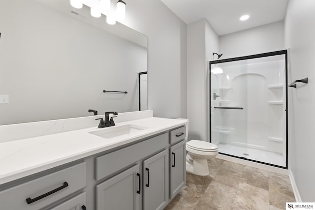 bathroom with stone finish floor, visible vents, a stall shower, toilet, and vanity