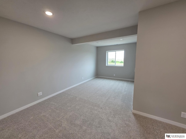 empty room with recessed lighting, carpet floors, and baseboards