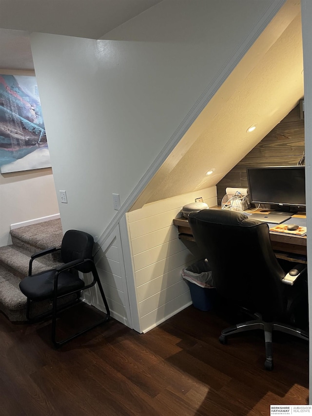office space featuring dark wood finished floors, baseboards, and vaulted ceiling