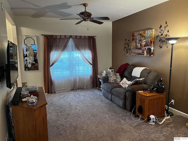 living area with carpet flooring and ceiling fan