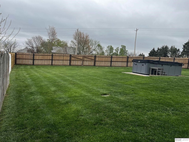 view of yard featuring a swimming pool and a fenced backyard