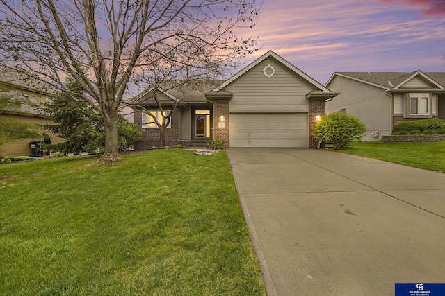 ranch-style house with brick siding, driveway, a front lawn, and a garage