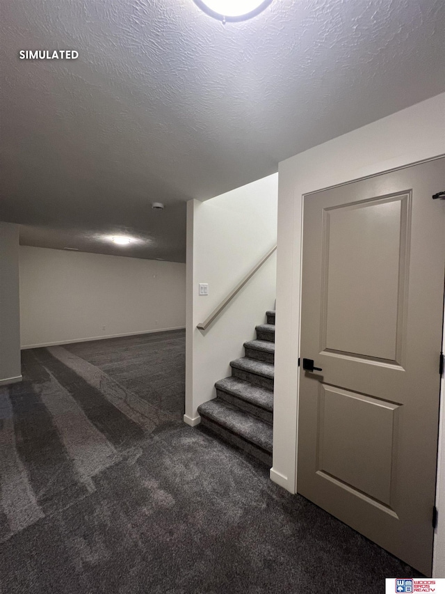finished basement featuring baseboards, stairway, and carpet floors