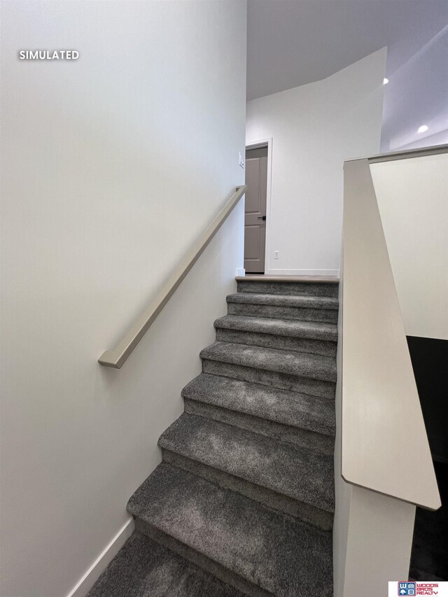 stairway featuring baseboards